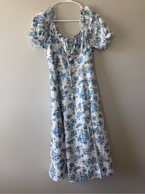 White Midi Dress with Blue Floral Print and Puff Sleeves. Slit In Front